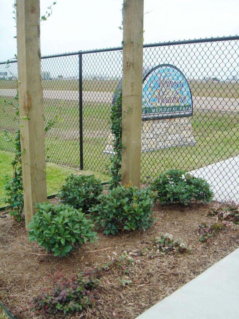 Plant Selections Memory Meadows Pet Memorial Park gated entrance